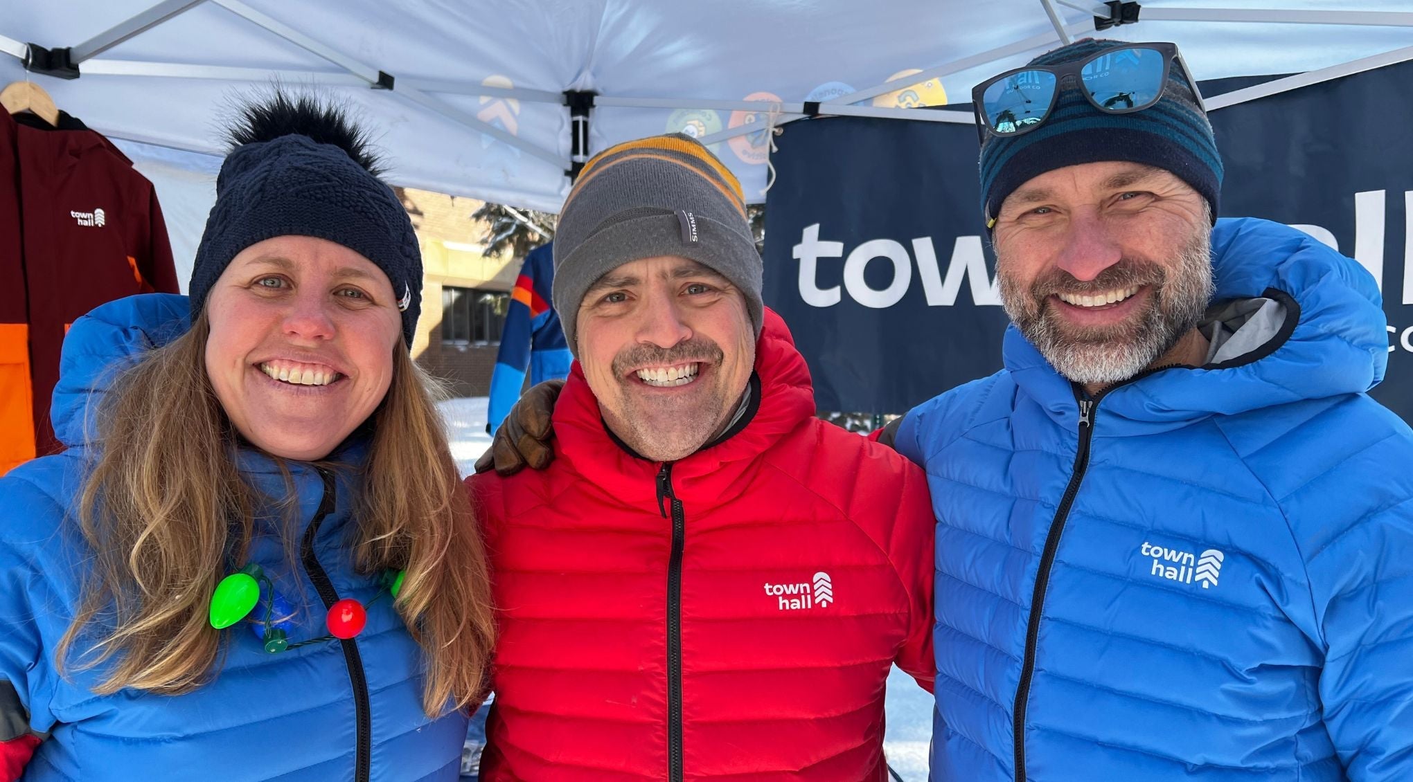 mom and daughter in outerwear smiling