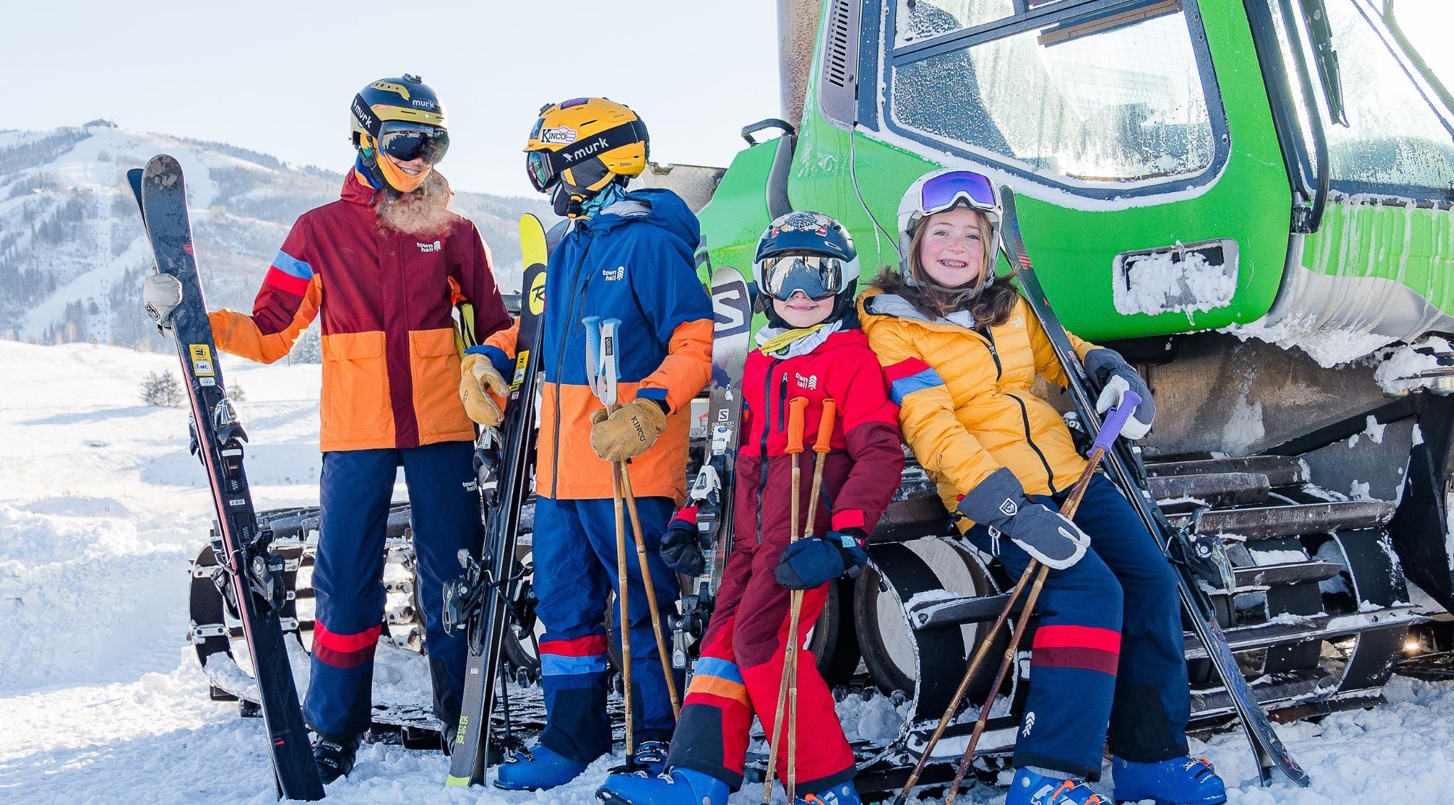 kid smiling in town hall down town puffy in snow