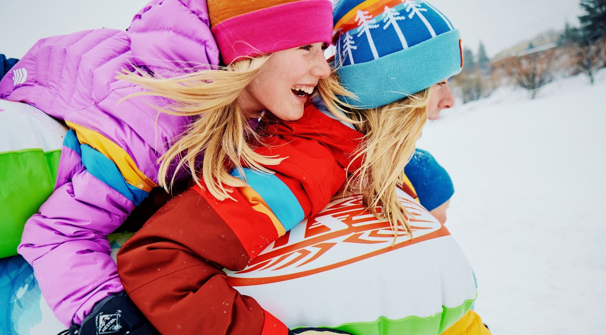 kids in front of a ski fence