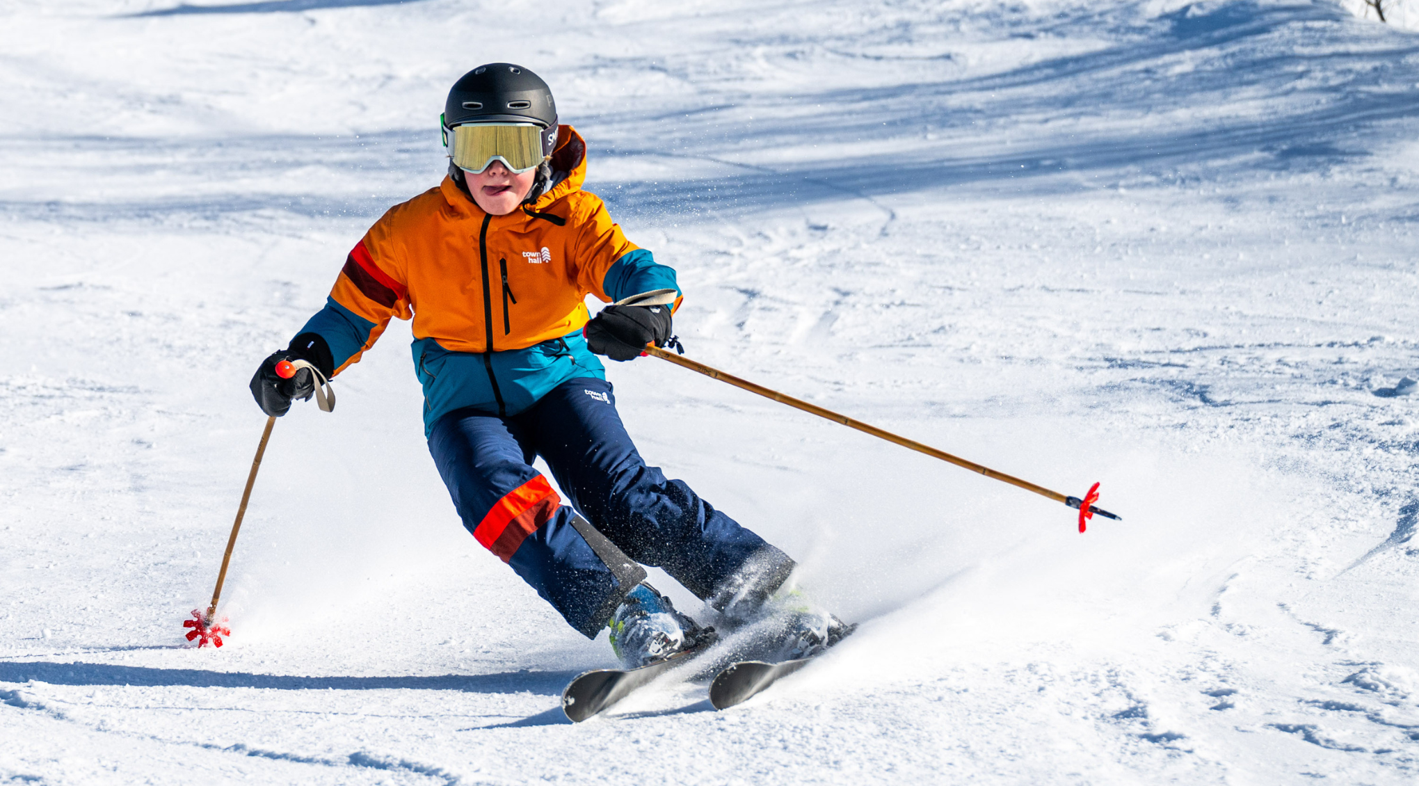 Kids sledding blissfully in Town Hall outerwear