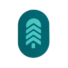 Close-up of the bright pine Town Hall x NOSO Gear Repair Patch featuring the Town Hall logo - a waterproof, machine-washable solution for extending gear life.