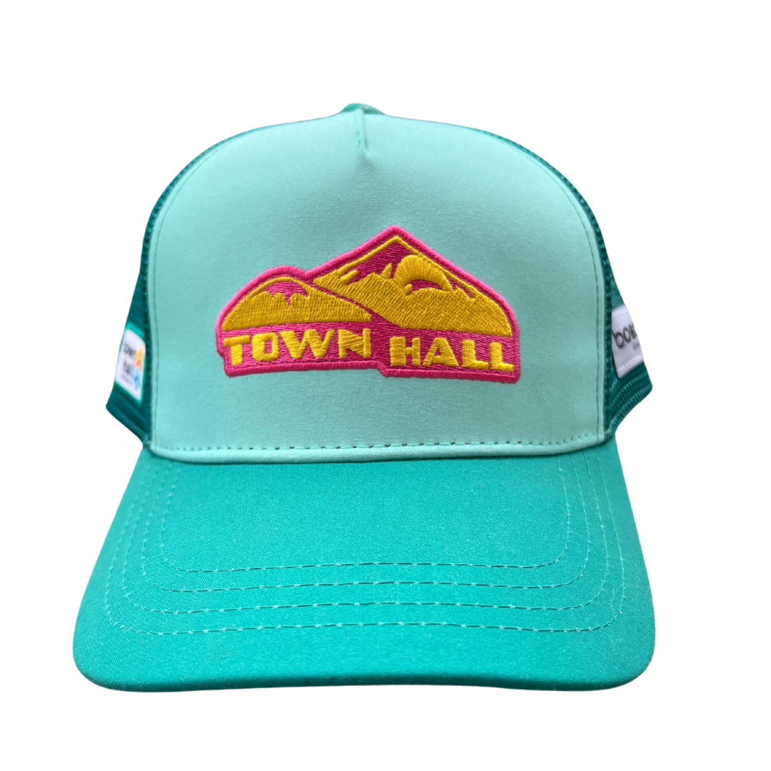 Teal cap with a pink and yellow 'Town Hall' logo on a white background