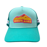 Teal cap with a pink and yellow 'Town Hall' logo on a white background