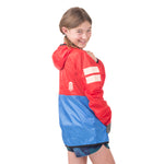 Back view of girl wearing the vibrant Goji Berry About Town Anorak, highlighting the fitted details that keep wind and rain out during outdoor adventures.