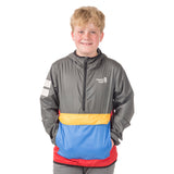 Young adventurer in the Dark Shadow About Town Anorak with Town Hall logo, demonstrating how this award-winning weather shell protects kids during outdoor play.
