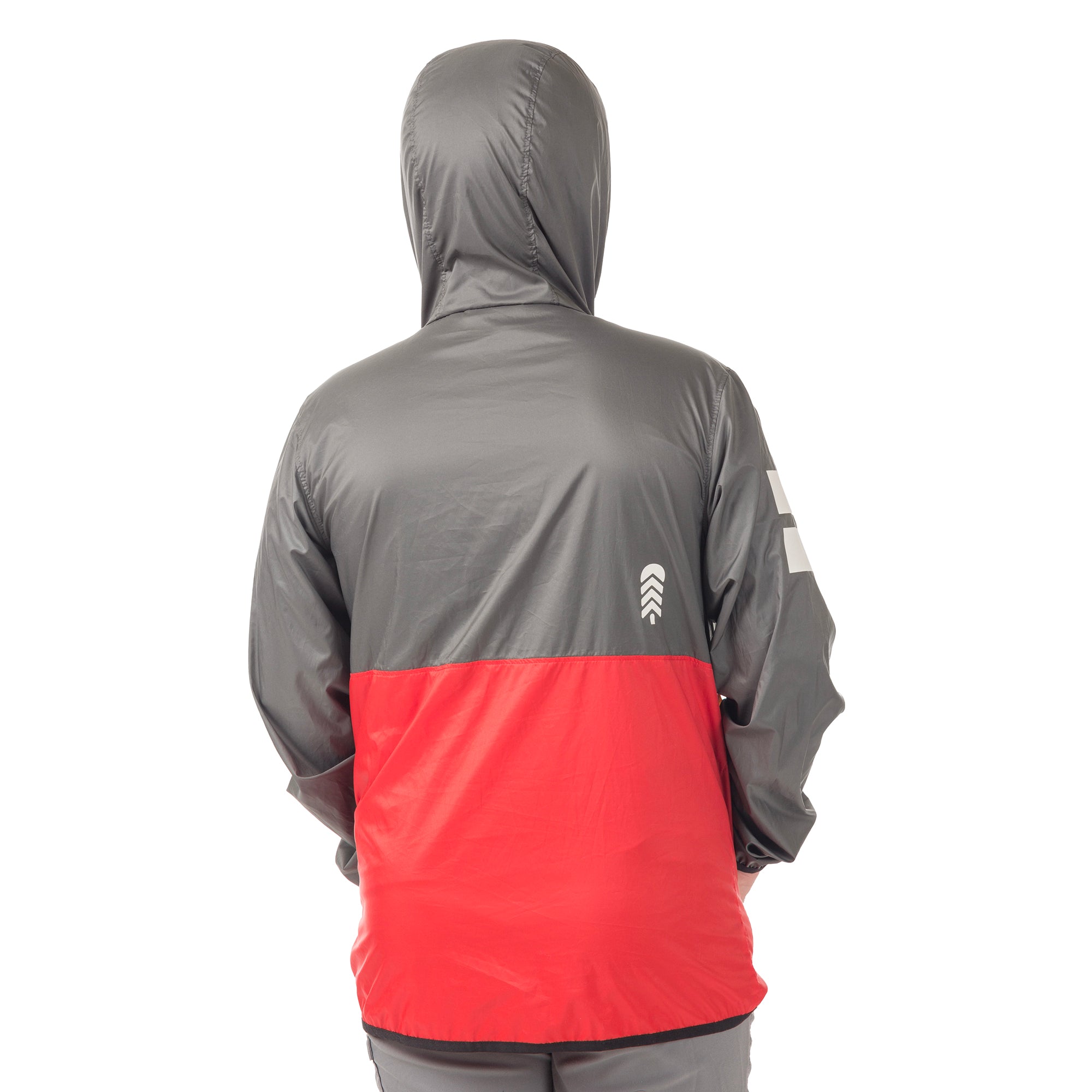 Rear view of the Dark Shadow About Town Anorak on boy model, showing the protective hood and streamlined design that keeps kids warm and dry during unexpected weather changes.