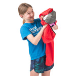 Girl demonstrating the easy-off design of the Goji Berry About Town Anorak, perfect for quickly adapting to changing weather during all-day outdoor play.