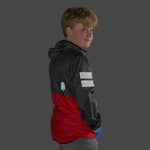 Detail view of the award-winning About Town Anorak in Dark Shadow on boy model, highlighting the elastic binding that provides secure protection against the elements.