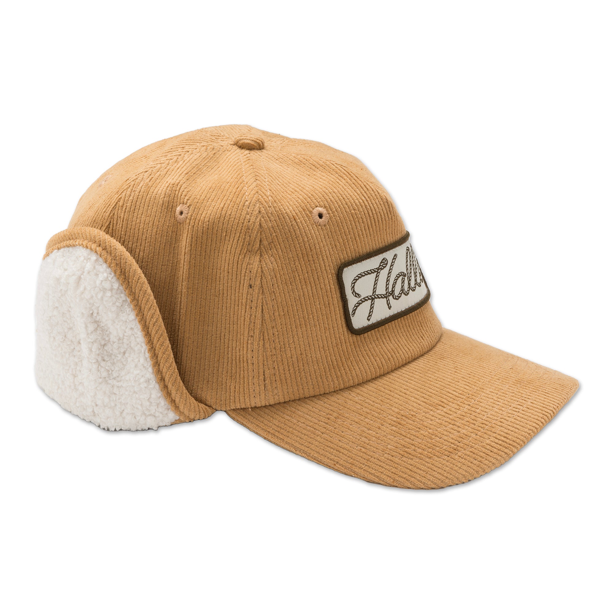 Side profile of our cozy adult ear flap hat with the flaps folded up, showing the distinctive silhouette and wooly texture perfect for mountain town style. 