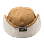 Back view of the Haller Ear Flap Hat with flaps up, showcasing the full recycled polyester knit texture and classic winter hat design for outdoor enthusiasts.