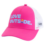 Angled view of pink Kids Trucker Hat with blue Love Outside lettering, white mesh and BOCO Gear side label.