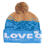 blue beanie with Love Outside embroidered on cuff and colorful pom