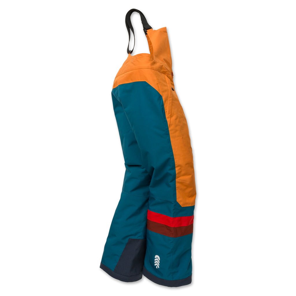 Side view of child wearing Town Hall's Peach Caramel/Blue Coral Winter Bib, showing how the waterproof snow pants provide coverage and mobility for active kids.