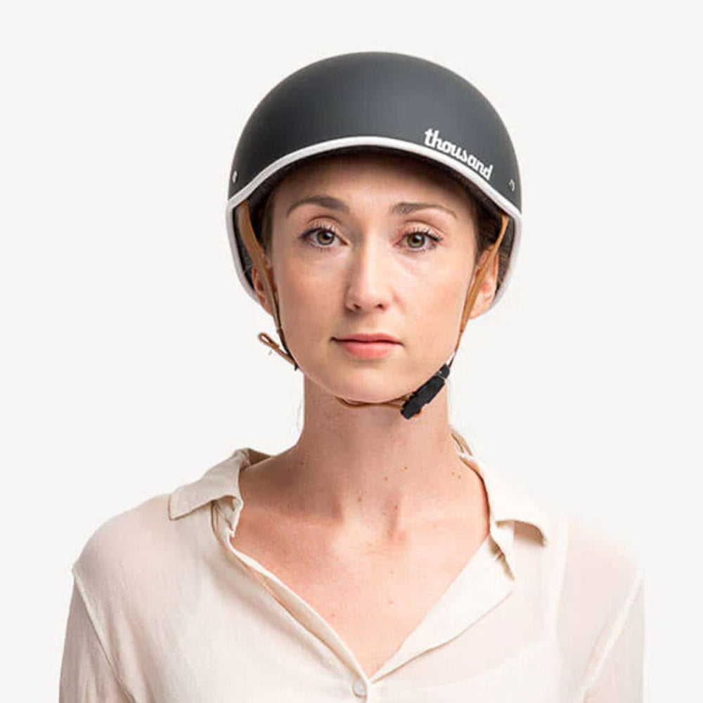 woman wearing Thousand bike helmet and ready to go for a ride