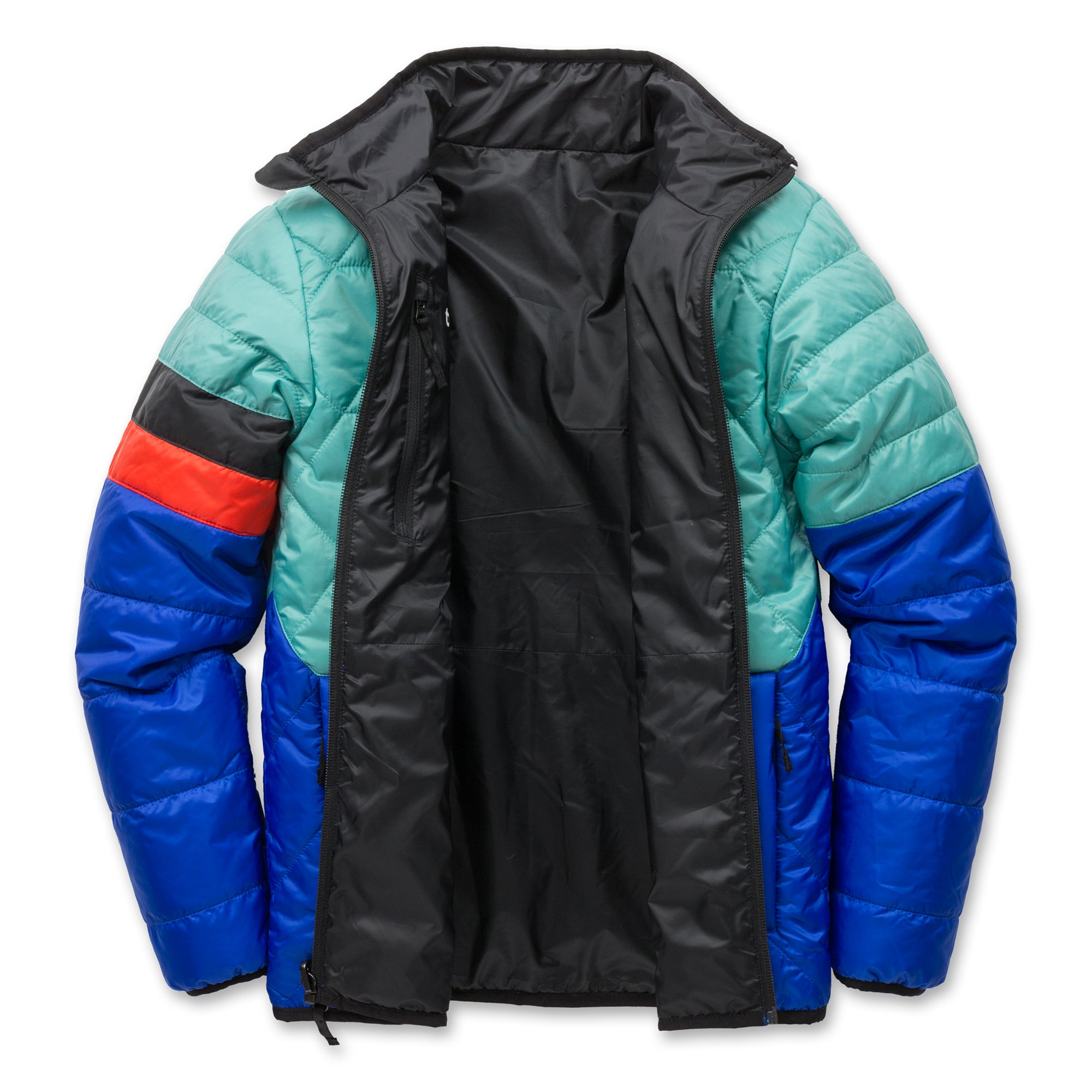 Canton blue Skip Town insulated jacket unzipped to show interior, highlighting the lightweight insulation and reversible design for adaptable warmth.