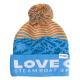 Front view of Town Hall Kids Love Outside Beanie in blue with mountain pattern, orange and yellow stripes, and pom-pom.