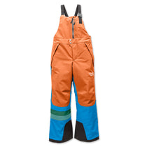 Orange and blue snow pants with suspenders on a white background