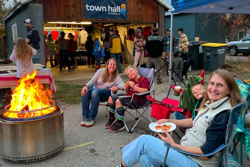 Group sitting around fire