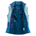 Blue puffy reversible vest for women laid open for the inside blue to see.