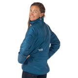 Woman showing the back of the dark teal OuttaTown Reversible Jacket with white Town Hall logo.