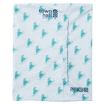 Town Hall's teal neck gaiter showing snowboarding bunny pattern and brand logo, featuring double-wall construction for all-day mountain comfort.