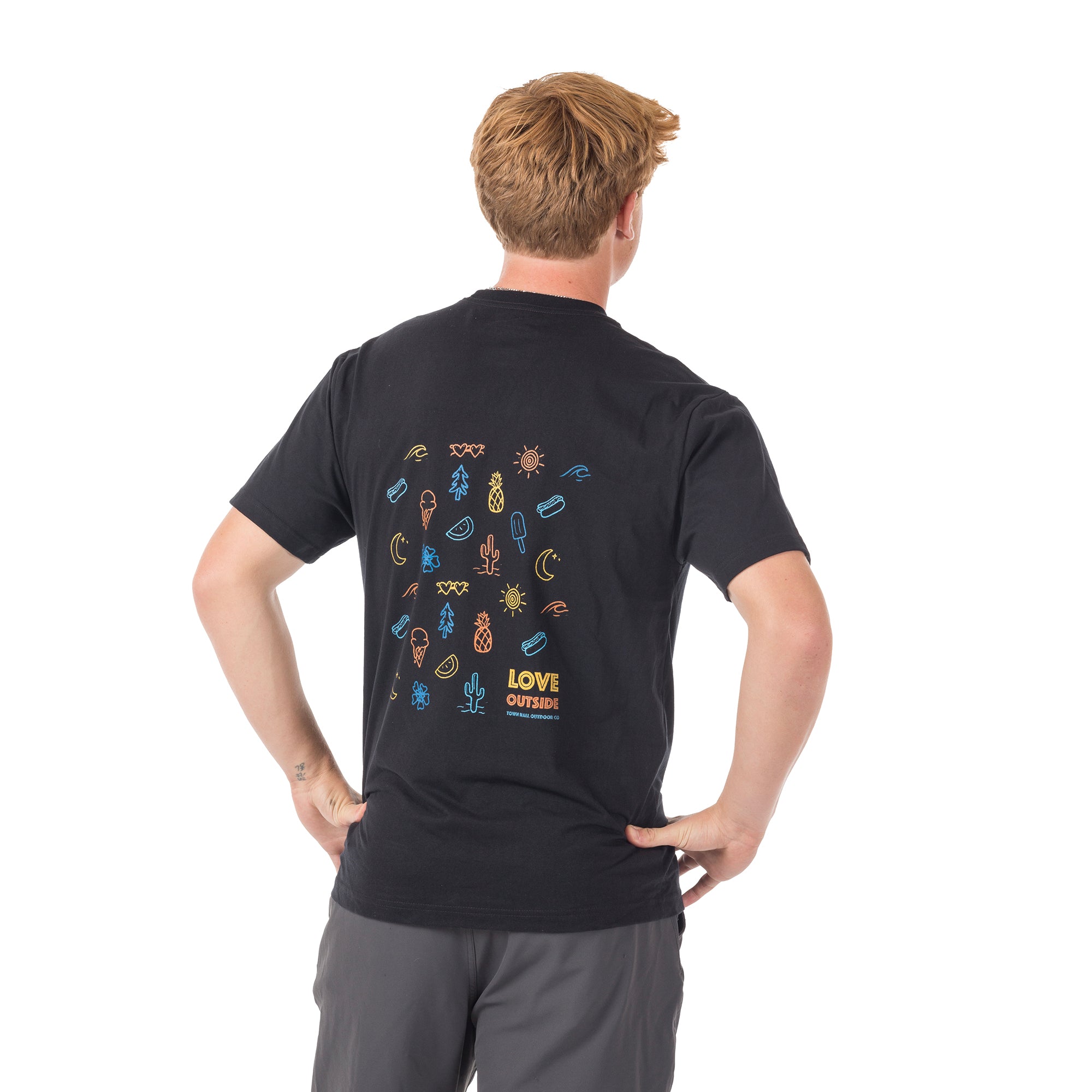 Back view of our black Adult Summertime Tee worn by a tall model, featuring playful vacation-inspired graphics with popsicles and sunshine that capture perfect summer adventure vibes.