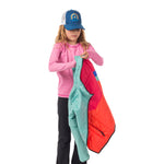 Girl demonstrating how easy it is to reverse the Skip Town insulated jacket, showcasing the jacket's two-in-one versatility for changing weather or moods.
