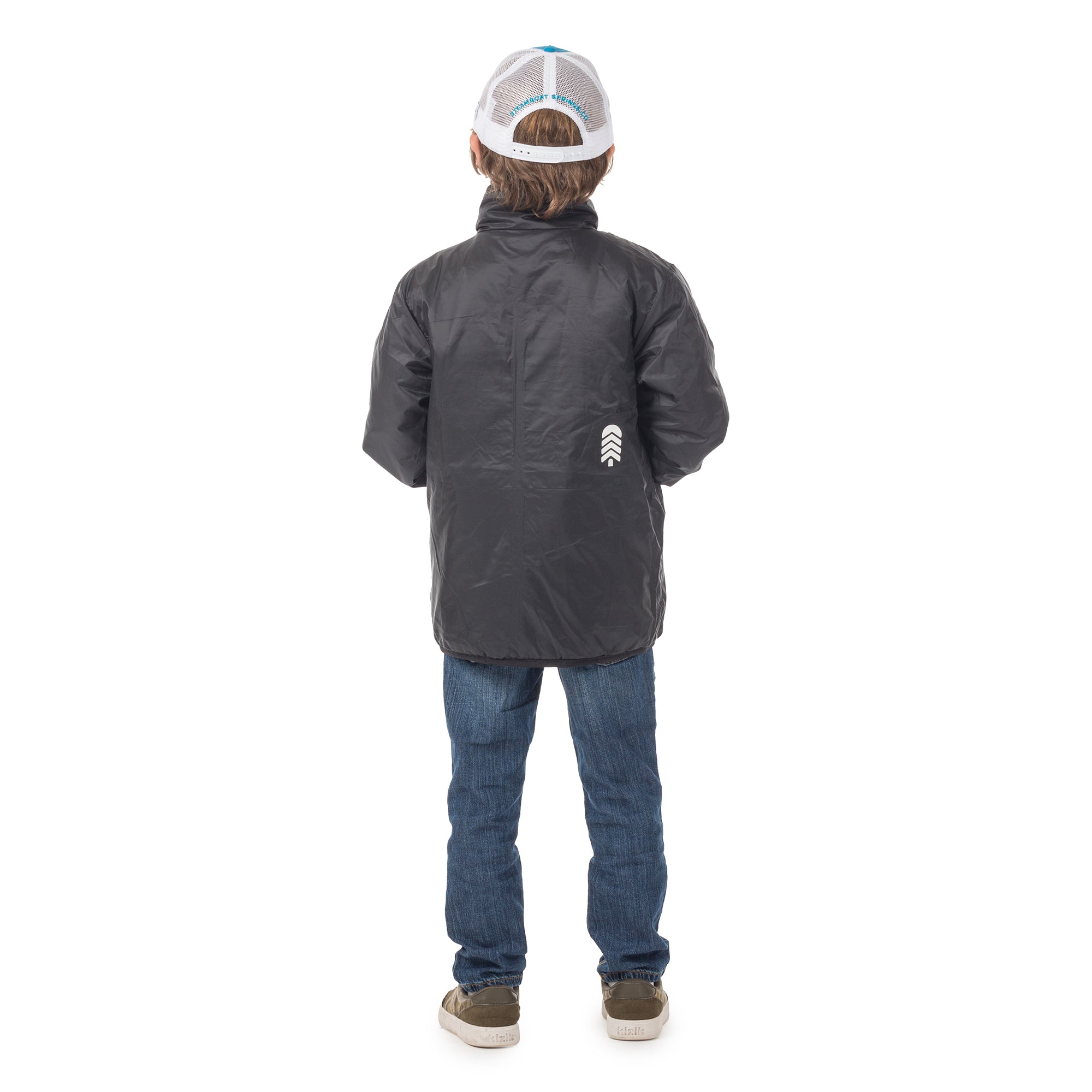 Back view of boy wearing the reversed Skip Town insulated jacket, showing the smooth fit and freedom of movement for active outdoor adventures.