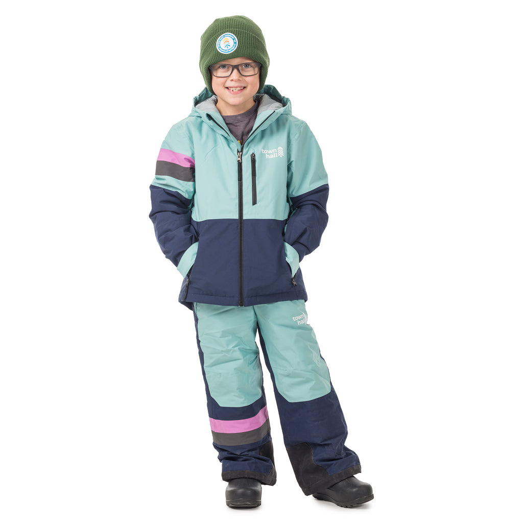 Child wearing Town Hall's waterproof Mountain Town Winter Bib in Canton/Black Iris with matching jacket - perfect for keeping young adventurers warm and dry during snowy activities. 