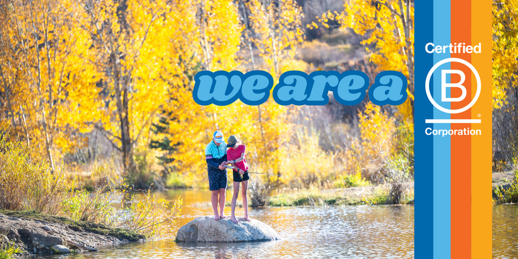 Two kids flyfishing in the fall leaves showing Town Hall is B Corp Certified