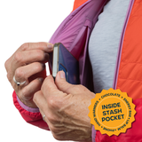 Person using a phone in a jacket with an 'Inside Stash Pocket' label.