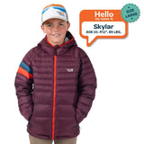 Skylar, age 10, wearing a size large Town Hall Down Town Puffy kids puffer jacket in Grape Jam purple.