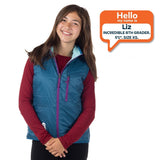 8th grade girl standing with XS size puffy vest on.
