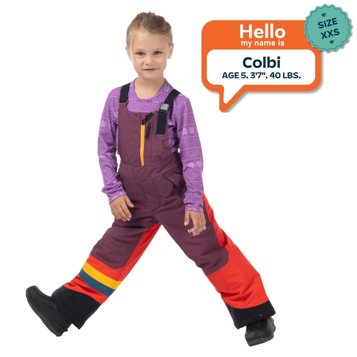 Colbi, age 5, wearing a size XXS Town Hall Mountain Town kids snow bib in Grape Jam purple and orange.