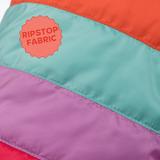 Multicolored fabric with 'Ripstop Fabric' label on a close-up of colorful material.