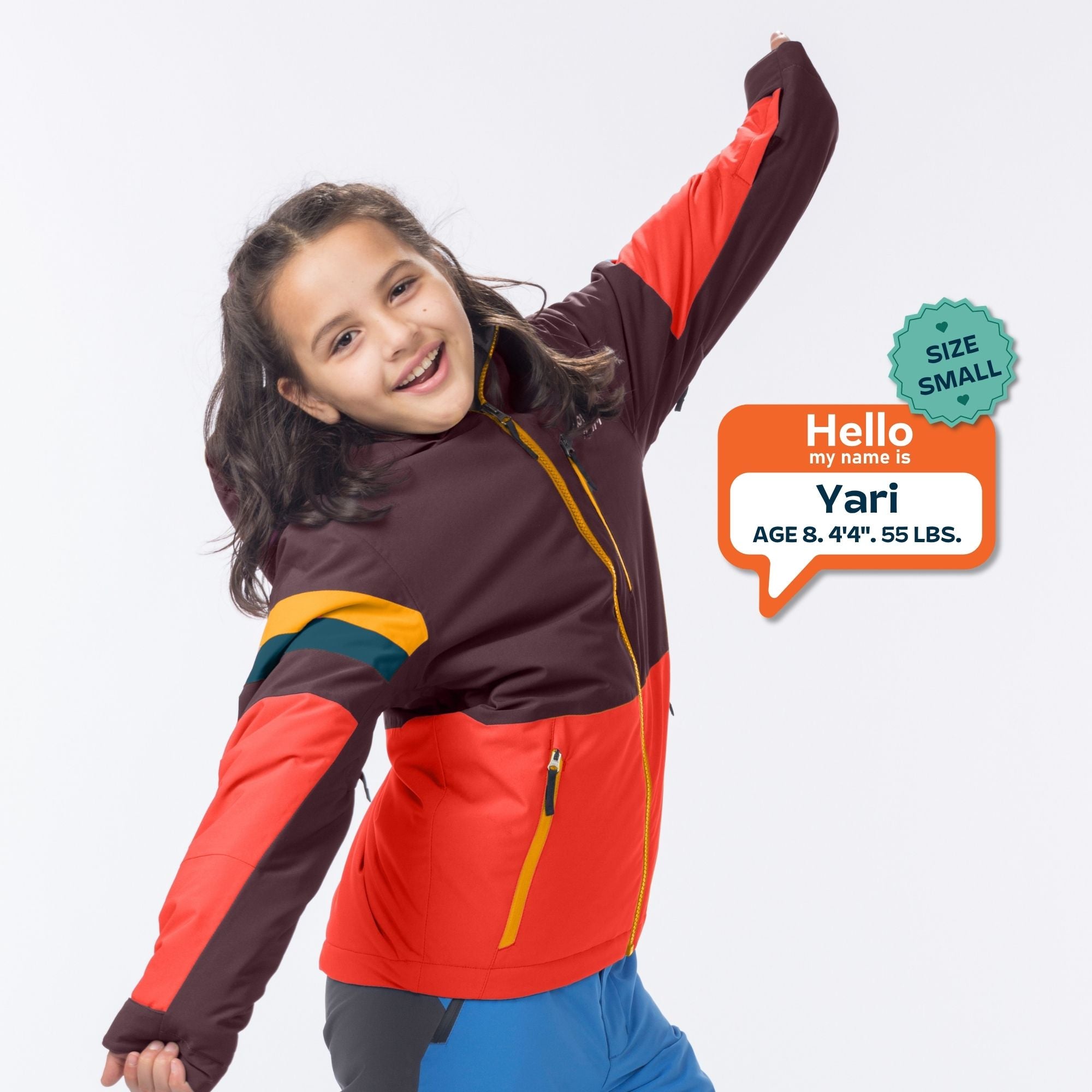 A young girl smiling and posing in a color-blocked winter jacket with a size badge overlay on a light gray background.