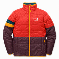 A quilted puffer jacket with a color-blocked design, featuring a bright red upper body, dark purple lower body and sleeves, and yellow trim along the zipper and collar. The left chest displays the white 'town hall' logo.