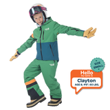 Child wearing a green and blue snowsuit with helmet and goggles, standing on a white background.