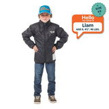 Liam, age 6, 4 feet 1 inch and 46 pounds, models size XS Skip Town Insulated Jacket on its black reverse side.