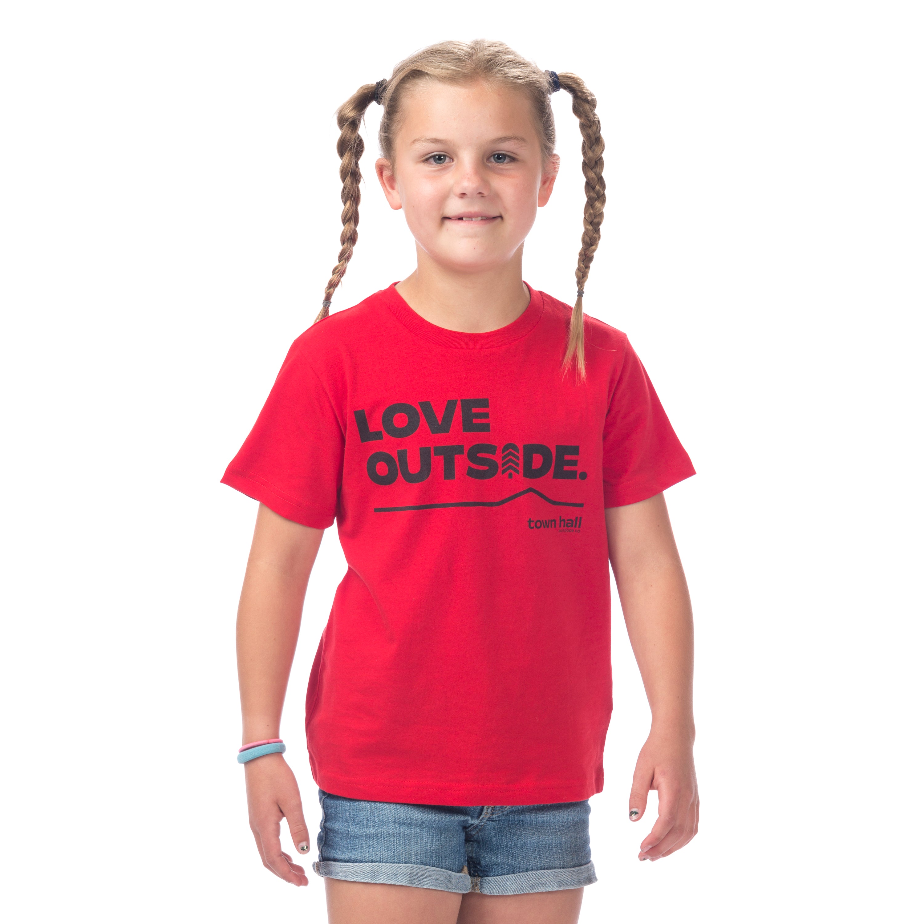 Young explorer wearing our comfy Red Kids Love Outside Tee with Town Hall logo, perfect for backyard discoveries.