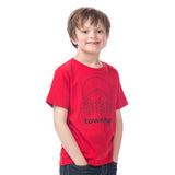 Boy modeling the red Kids Town Slope Tee featuring the Town Hall logo, perfect for ski days and outdoor playtime.