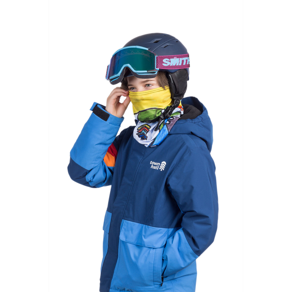 Young skier wearing Town Hall's complete ski gear including the Neck Gaiter from the Young Artist Collection, perfect for staying warm and comfortable on the slopes.