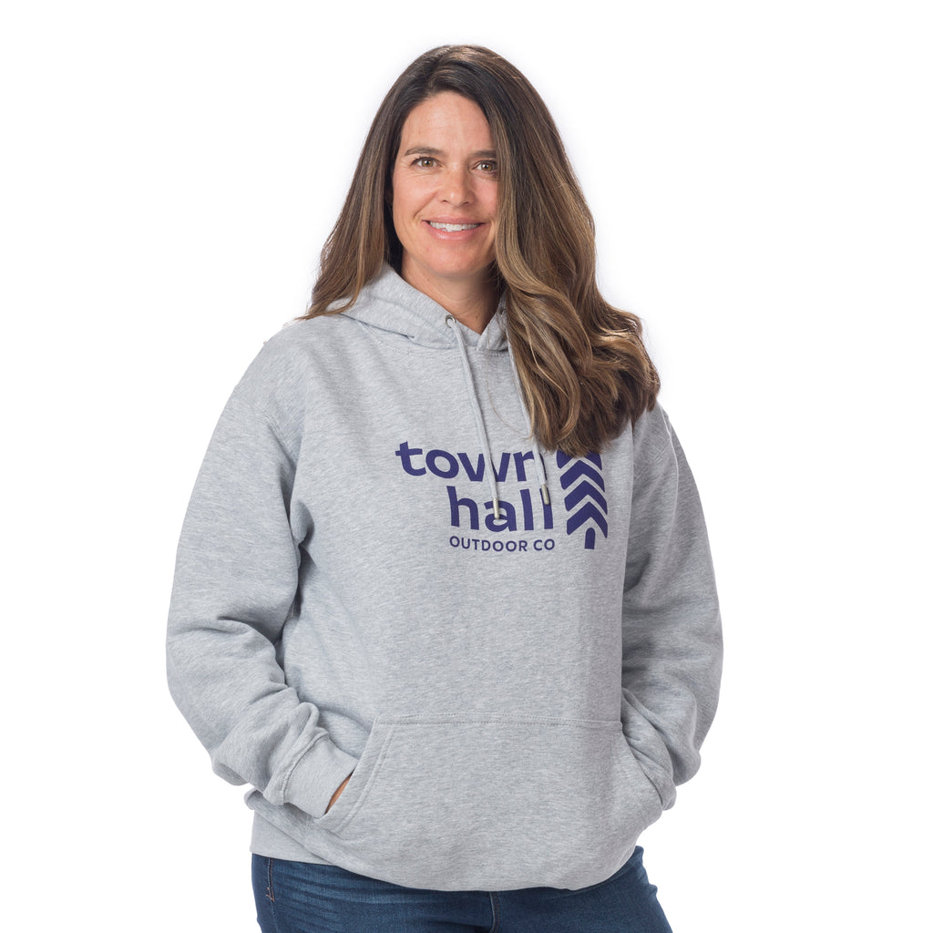 Front view of man in Town Hall's signature Heather Gray Hoodie Sweatshirt, demonstrating the comfortable fit perfect for bike park laps or relaxing outdoors.