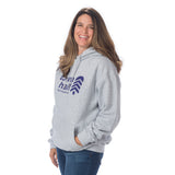 Woman shown from side angle modeling the cozy Town Hall Logo Hoodie Sweatshirt in Heather Gray, highlighting the gender-neutral fit and ribbed cuffs.